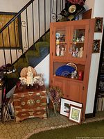 full view of cabinet, chest and surrounding décor