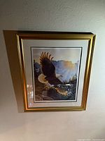 Full view of framed Lee Cable print on wall