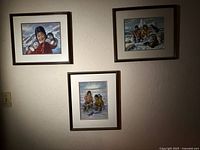 All three framed prints on wall