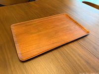 Top view of entire teak tray on table