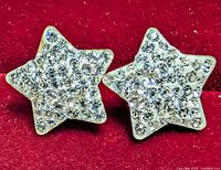 front view of both star crystal earrings showing pavé setting