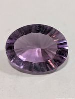Top view of oval faceted light purple amethyst