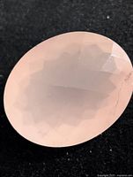 Front view of oval faceted rose quartz