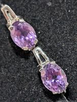 Close-up of two amethyst stones set in silver