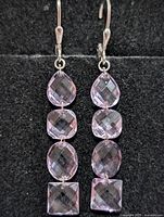 Front view of both earrings showing stone arrangement and colour