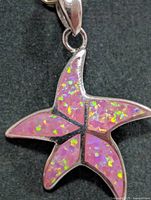 Front view of starfish pendant displaying opalite inlay and bail