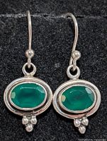 Front view showing green onyx stones and silver setting