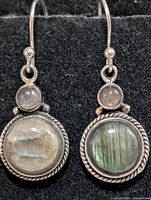 Front view showing both earrings with labradorite cabochons and rope detailing