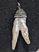 Front view of silver and pearl pendant