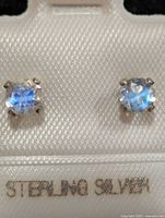 Front view of moonstone studs in sterling silver settings