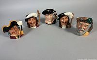 Front group view of all five Royal Doulton Toby mugs