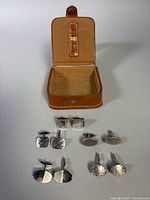 Full lot: five pairs cufflinks inside open Birks leather box