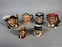 Group shot of six Royal Doulton character jugs