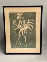 Full view of framed print under glass