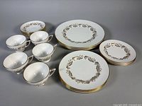 Full set laid out showing plates, cups and saucers