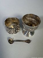 Egg cup, napkin ring, spoon grouped
