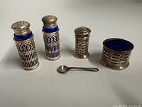 Full set of sterling lattice shakers, cellar, spoon with cobalt liners