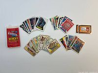 Fronts of assorted Wacky Packages, Garbage Pail Kids, Nightmare on Elm Street, Fright Night cards plus wax wrapper and sticker