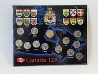 Front of set showing 13 coins in Canada 125 map card