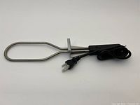 Full view of electric charcoal lighter with cord coiled