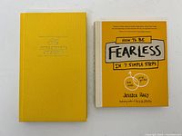 Front covers of both yellow hardcover books