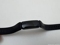 Fitbit tracker watch front view showing screen and strap