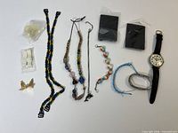 Overview of all items including jewelry, straps, watch, nylons