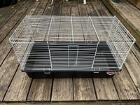 Top view of entire cage showing wire enclosure and plastic base