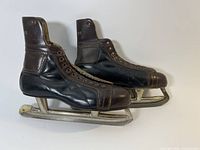 side view of both skates showing color and blades