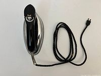 Top view of GE dry iron with cord visible