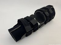 Overall view of the black Zimmer leg brace showing straps and hinge