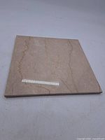 Top view of square beige marble slab
