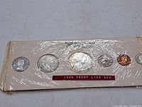 Front view of sealed 1960 Royal Canadian Mint proof-like set showing all six coins in holder