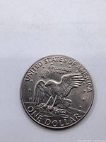 Reverse of 1974-D Eisenhower dollar showing eagle landing on moon design