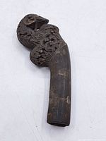 Full view of carved wooden cane handle