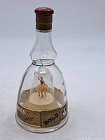Front view of Bols Ballerina bottle showing stopper, label, and figurine