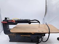 Full view of Craftsman scroll saw with MDF replacement tabletop and attached power cord