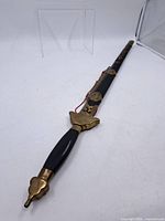 Full view of sword in scabbard