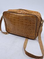 Full view of Eaton tan crocodile-embossed leather shoulder bag with strap