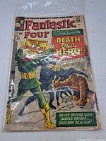 Front cover of Fantastic Four #32 in bag