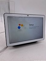 Front view showing 10-inch display powered on at setup screen