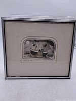 Front view of framed etching showing artwork, mat and frame