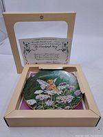 Plate inside presentation box with certificate visible