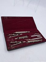 Open case showing all drafting instruments