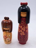 Both Kokeshi dolls front view