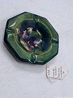 Top view showing entire ashtray shape, glaze color and orchid artwork