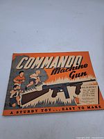 Front cover of Commando Machine Gun cut-out model booklet