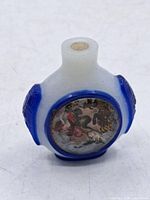 Front view showing blue overlay and zodiac medallion