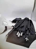 Kit laid out showing light stands, support rods, softbox fabric and bag