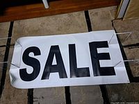 Full view of banner showing "SALE" text and overall size